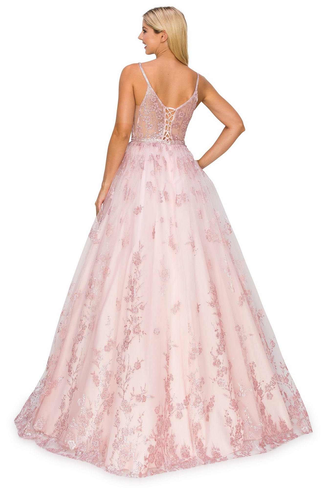 A woman with long blonde hair models the Corset-Back Long Glitter Prom Ball Gown 8039J, showcasing a light pink lace skirt, sheer back, lace-up detail, and elegant floral embroidery as she faces away in this dreamy look.